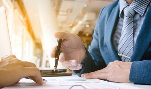 Advisors reviewing infrastructure project financials
